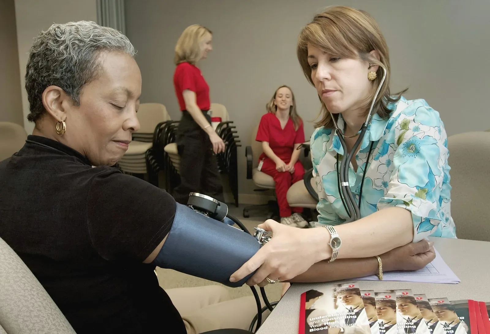 A clinician reviewing notes on a tablet